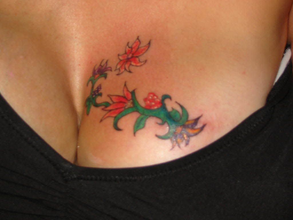 Sexy Flower Tattoo on Woman Breast title=