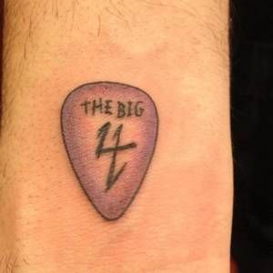 guitar plectrum tattoo
